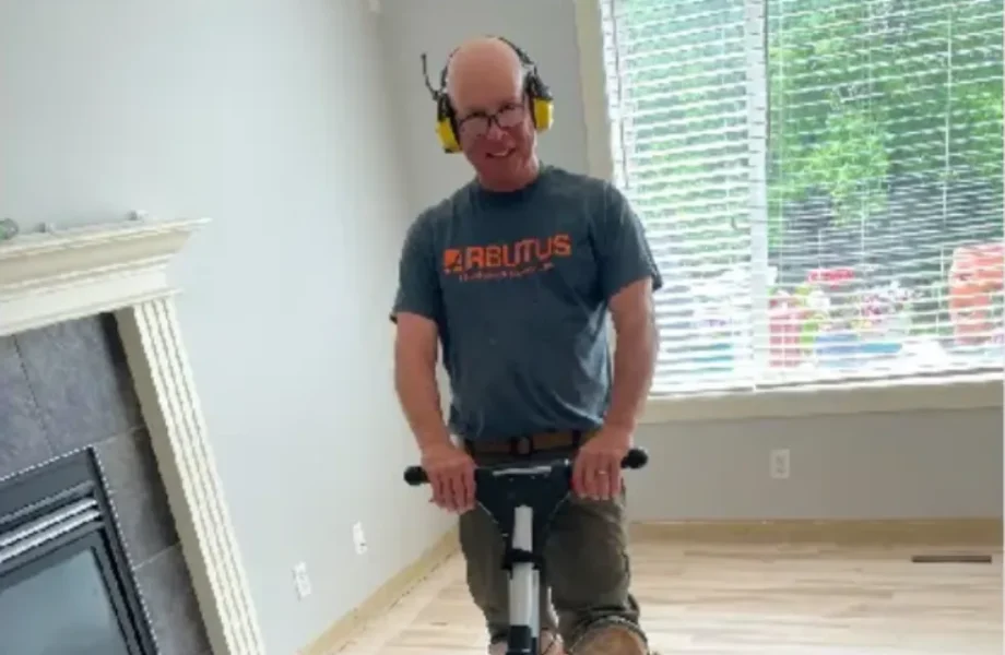 Arbutus Hardwood Worker Sanding Hardwood Floor